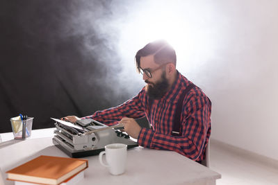 Mid adult man holding coffee cup