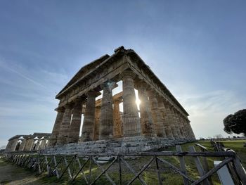 Low angle view of the temple of poseidon against sky