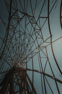 Low angle view of metallic structure against sky