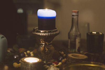 Close-up of tea light candles on table