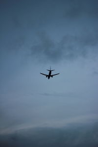 Low angle view of airplane in sky