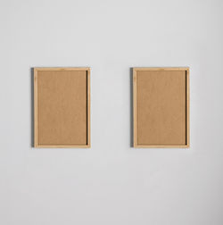 Close-up of clothes hanging on white wall