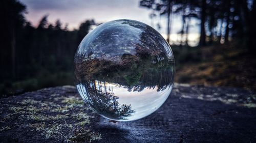 Close-up of crystal ball on glass