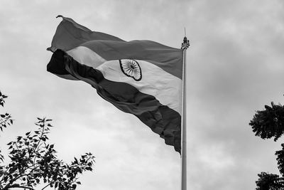 India flag flying high at connaught place with pride in blue sky, india flag fluttering, indian flag