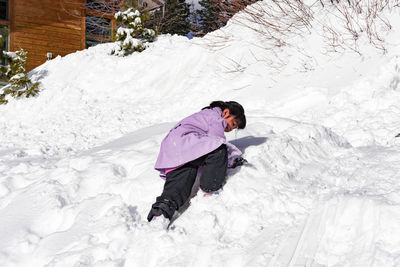 High angle view of girl on snow field