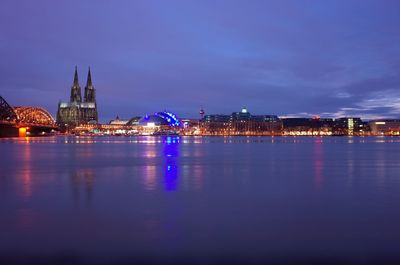 Illuminated city at waterfront