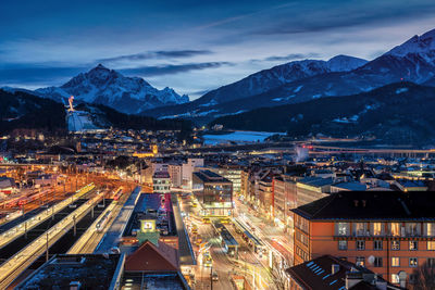 Aerial view of illuminated city at dusk