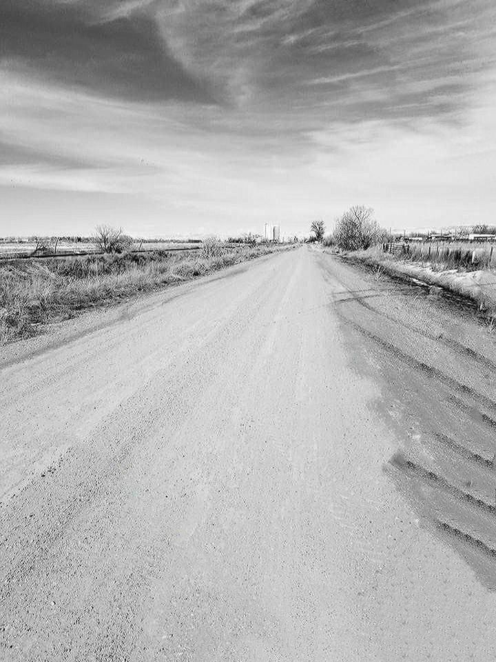 the way forward, sky, direction, road, transportation, landscape, vanishing point, diminishing perspective, no people, environment, nature, cloud - sky, land, field, plant, tranquility, tranquil scene, day, tree, non-urban scene, outdoors, long