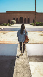 Rear view of woman walking outdoors