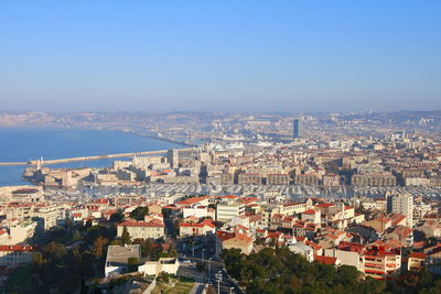 High angle view of townscape against blue sky