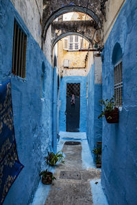 Historical tiny street, indigo blue houses in the old medina jewish quarter in fez, morocco, africa.