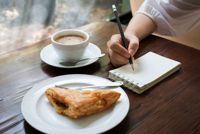 Close-up of coffee cup on table