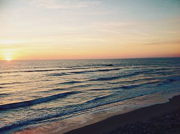 Scenic view of sea at sunset