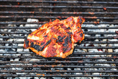 High angle view of meat on barbecue grill