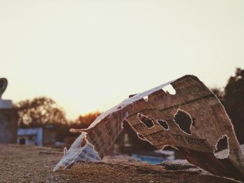 Close-up of damaged building against clear sky