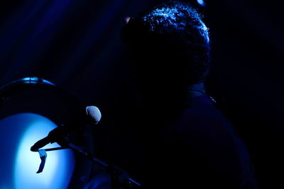 Rear view of man at music concert