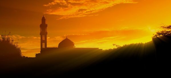 Silhouette mosque against sky during sunset