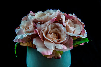 Close-up of rose bouquet against black background