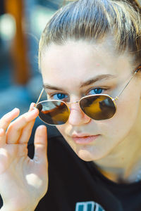 Close-up portrait of man wearing sunglasses