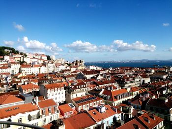 View of town against cloudy sky