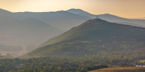 Scenic view of landscape against sky during sunset