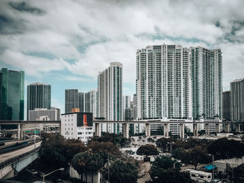 Modern buildings in city against sky