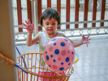 Portrait of cute girl with arms outstretched