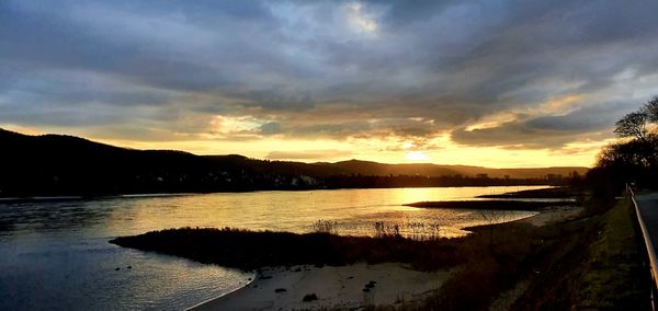 Scenic view of lake against sky during sunset