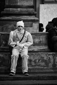 Portrait of man sitting on steps