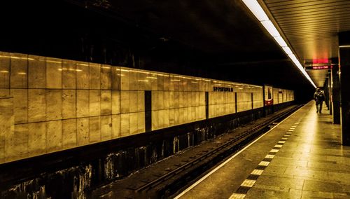 Train at railroad station at night