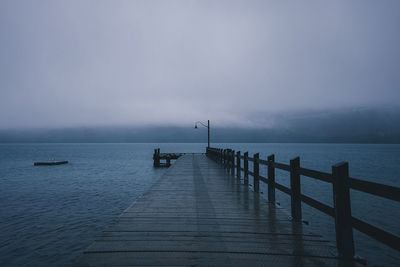 Pier over sea against sky