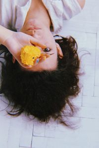 High angle view portrait of woman relaxing at home