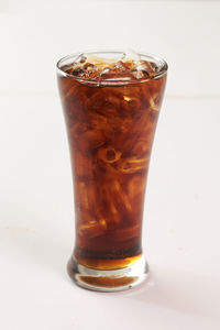 Close-up of ice tea against white background