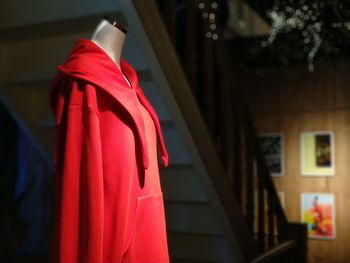 Close-up of red clothes hanging on building