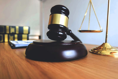 Close-up of hammer at desk in office