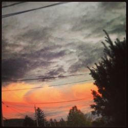 Low angle view of cloudy sky at sunset