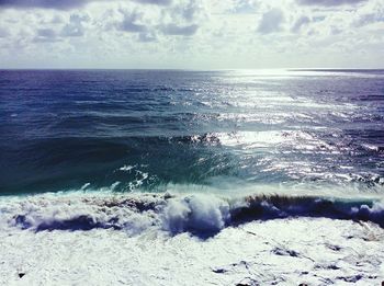 Scenic view of sea against cloudy sky