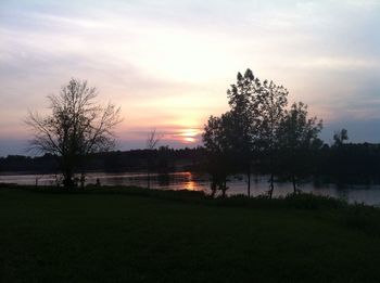 Scenic view of lake at sunset