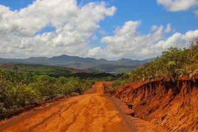 Dirt road passing through mountains