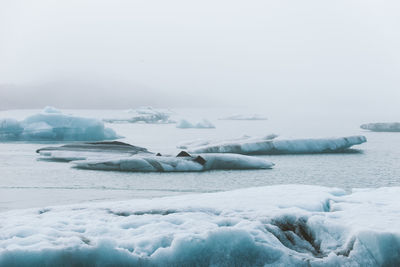 Scenic view of frozen lake against sky