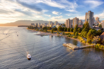 Scenic view of sea and buildings against sky