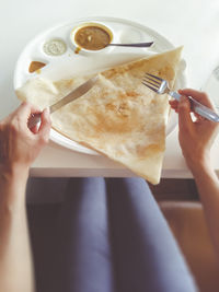 Midsection of woman holding ice cream