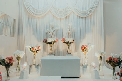 Flower vase on table at home