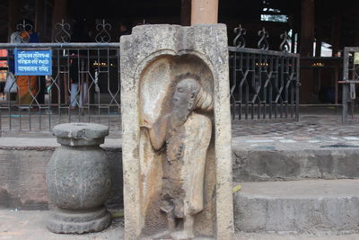 Statue of buddha outside building