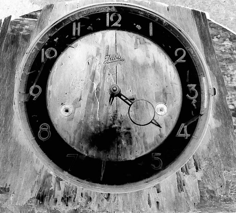 CLOSE-UP OF CLOCK ON WALL