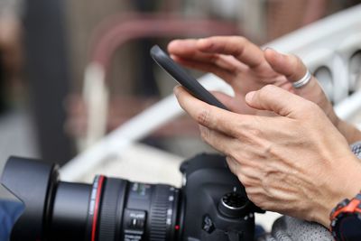 Close-up of man using mobile phone