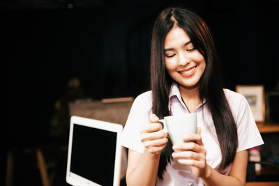 Young woman using smart phone
