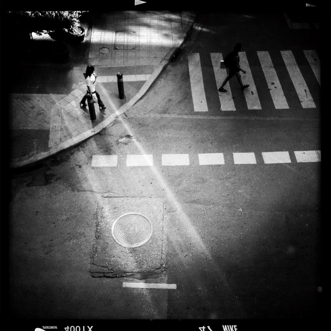 transportation, transfer print, street, road marking, auto post production filter, illuminated, mode of transport, walking, shadow, road, men, night, the way forward, arrow symbol, text, guidance, city life, bicycle, lifestyles