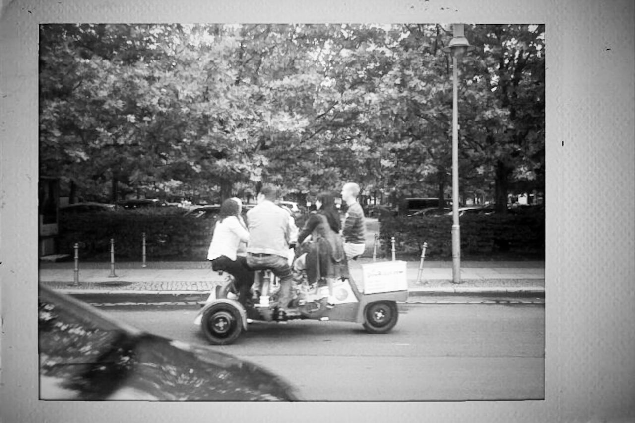 mode of transport, transportation, land vehicle, men, lifestyles, car, tree, leisure activity, street, transfer print, full length, on the move, person, rear view, togetherness, bicycle, road, auto post production filter