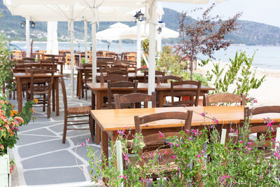 Empty chairs and table at restaurant